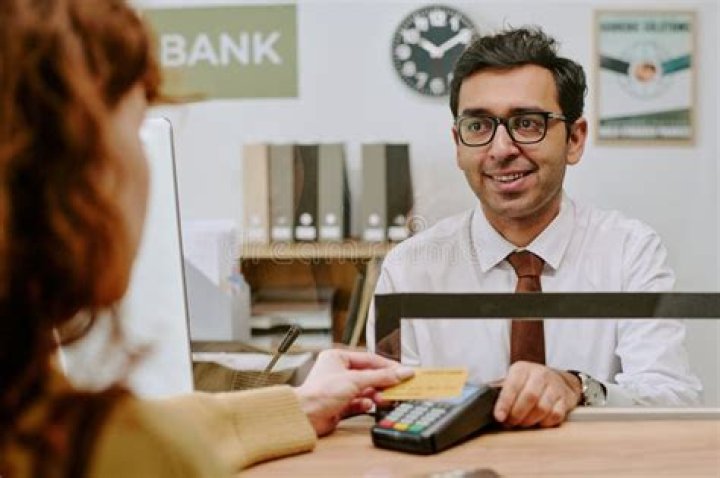 Is an employee of a bank who deals directly with customers?